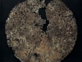 Il disgregarsi della materia 1, ferro combusto su tavola e copertura in plexiglas, 64x64, 2007