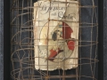 Senza titolo, 2015, ferro combusto e libro, inseriti in scatola di legno, 30x40
